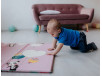 Малыш на развивающем коврике